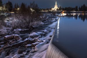 Photo of the temple reflecting in the snake river in downtown Idaho Falls